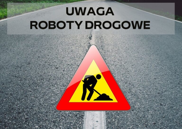 Znak uwaga roboty drogowe na asfaltowej drodze